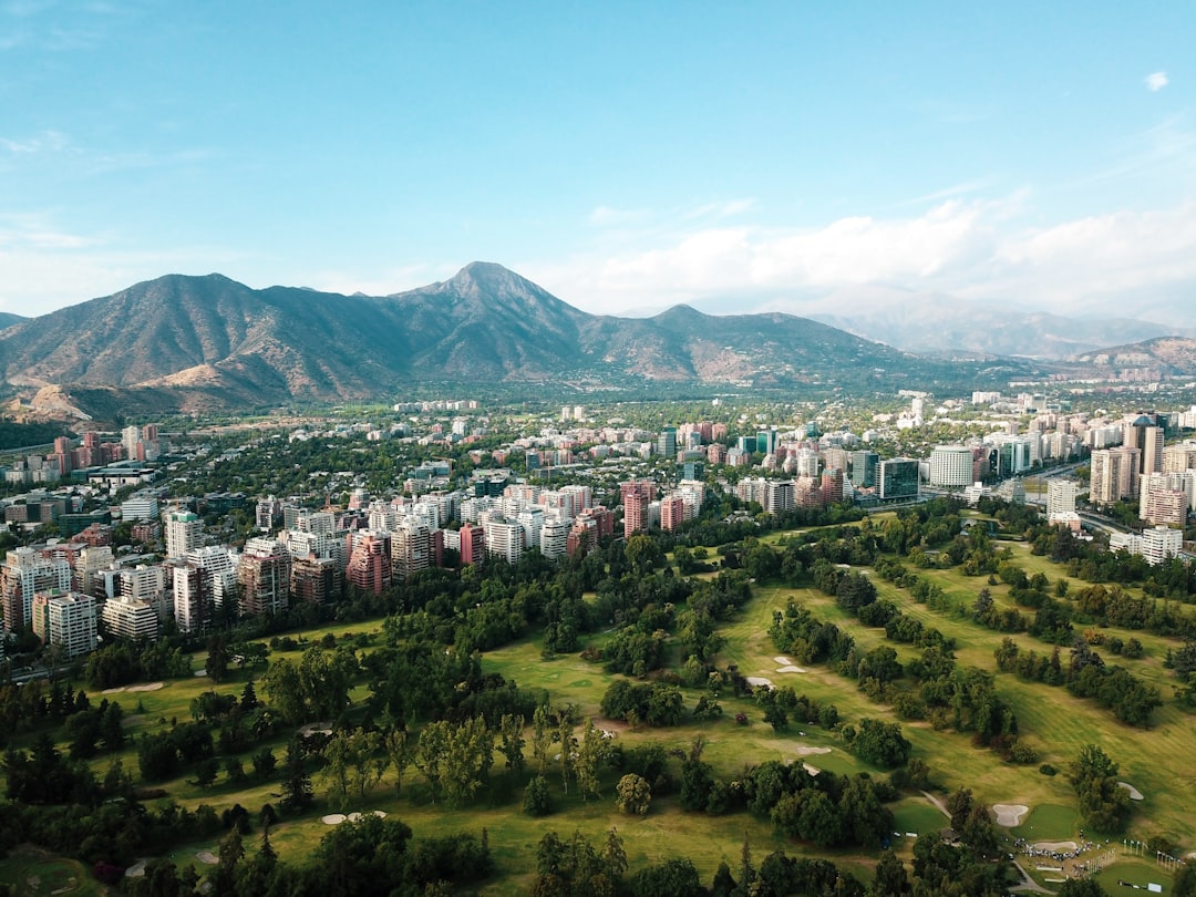 Photo by Francisco Kemeny city buildings on green grass field during daytime